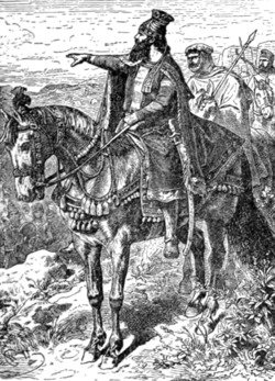 Na imagem, é possível ver Ciro, o grande, num cavalo. Ele aponta para o horizonte.