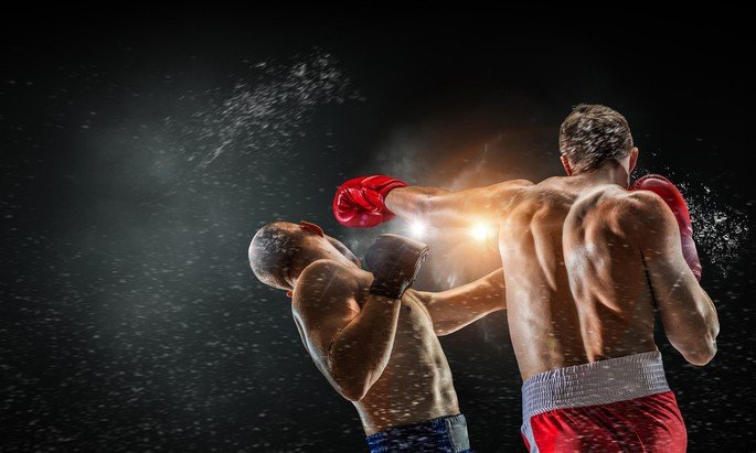 Boxeador dando golpe em adversário